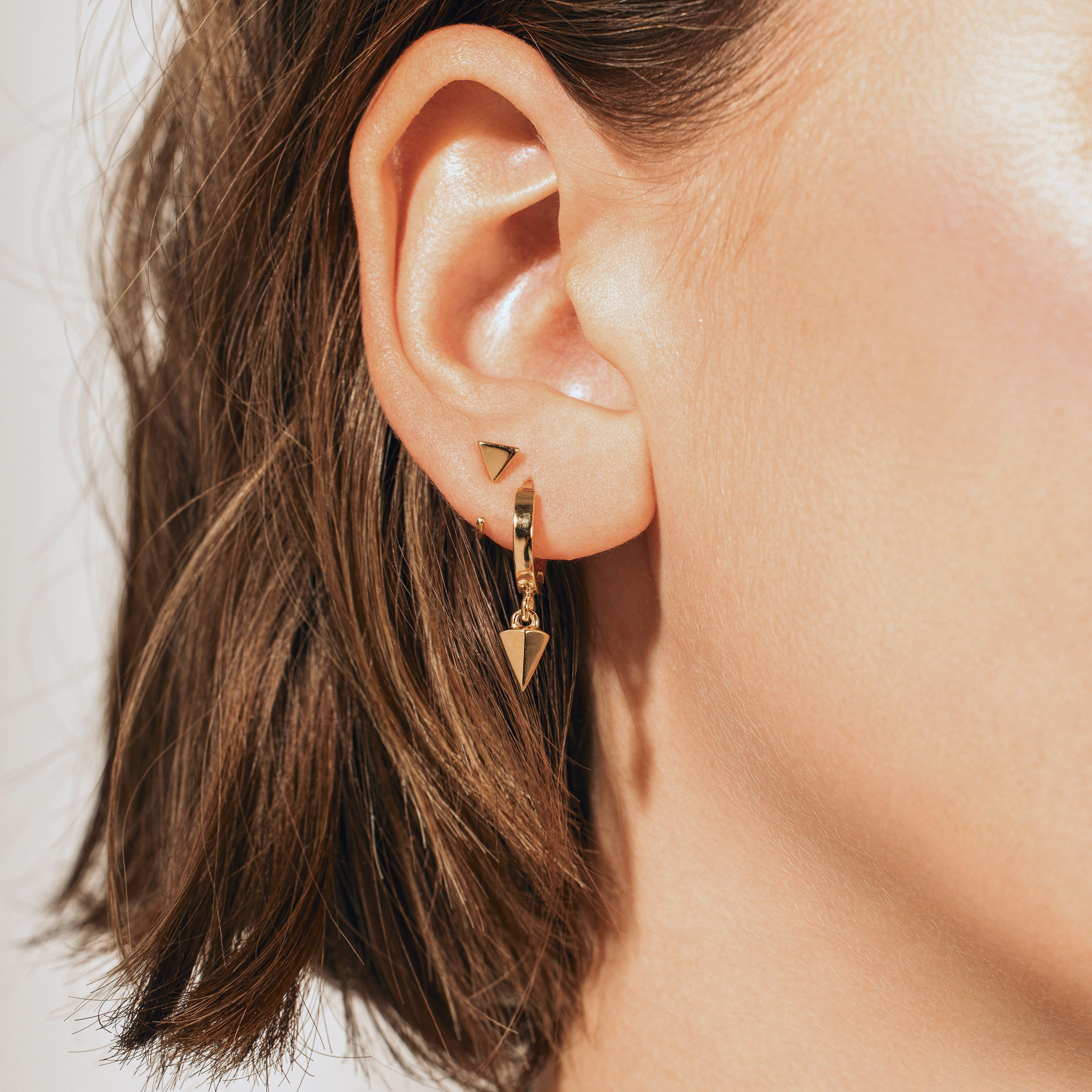 Triangle huggie earrings sales