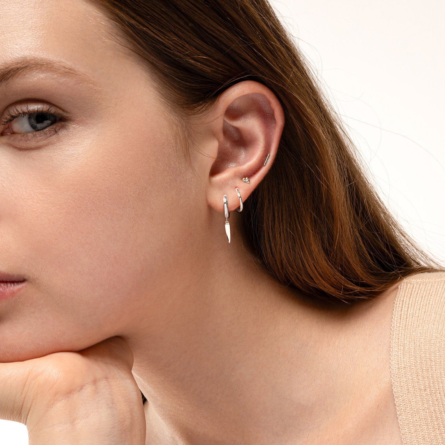Dagger huggie earrings deals