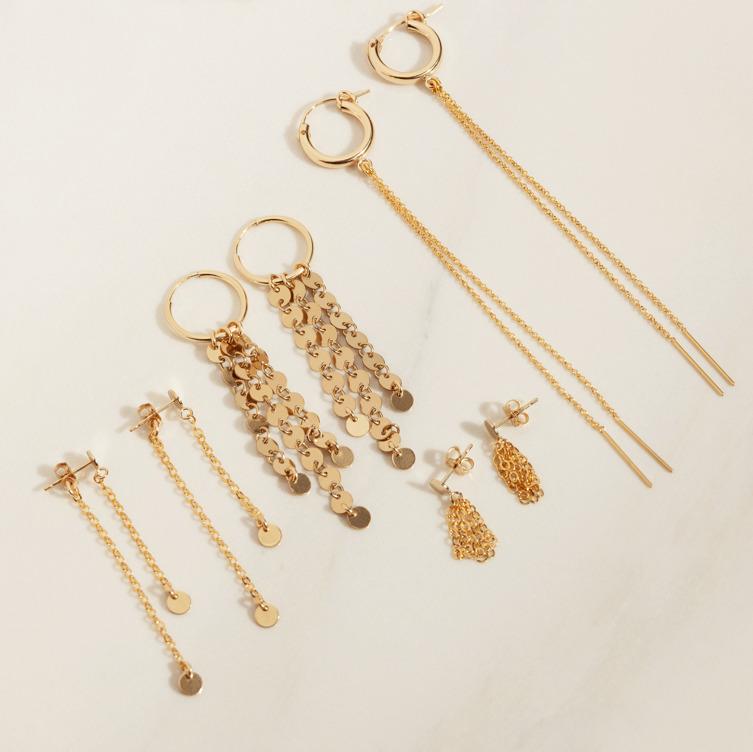 Dubbla skivörhängen med hängande design