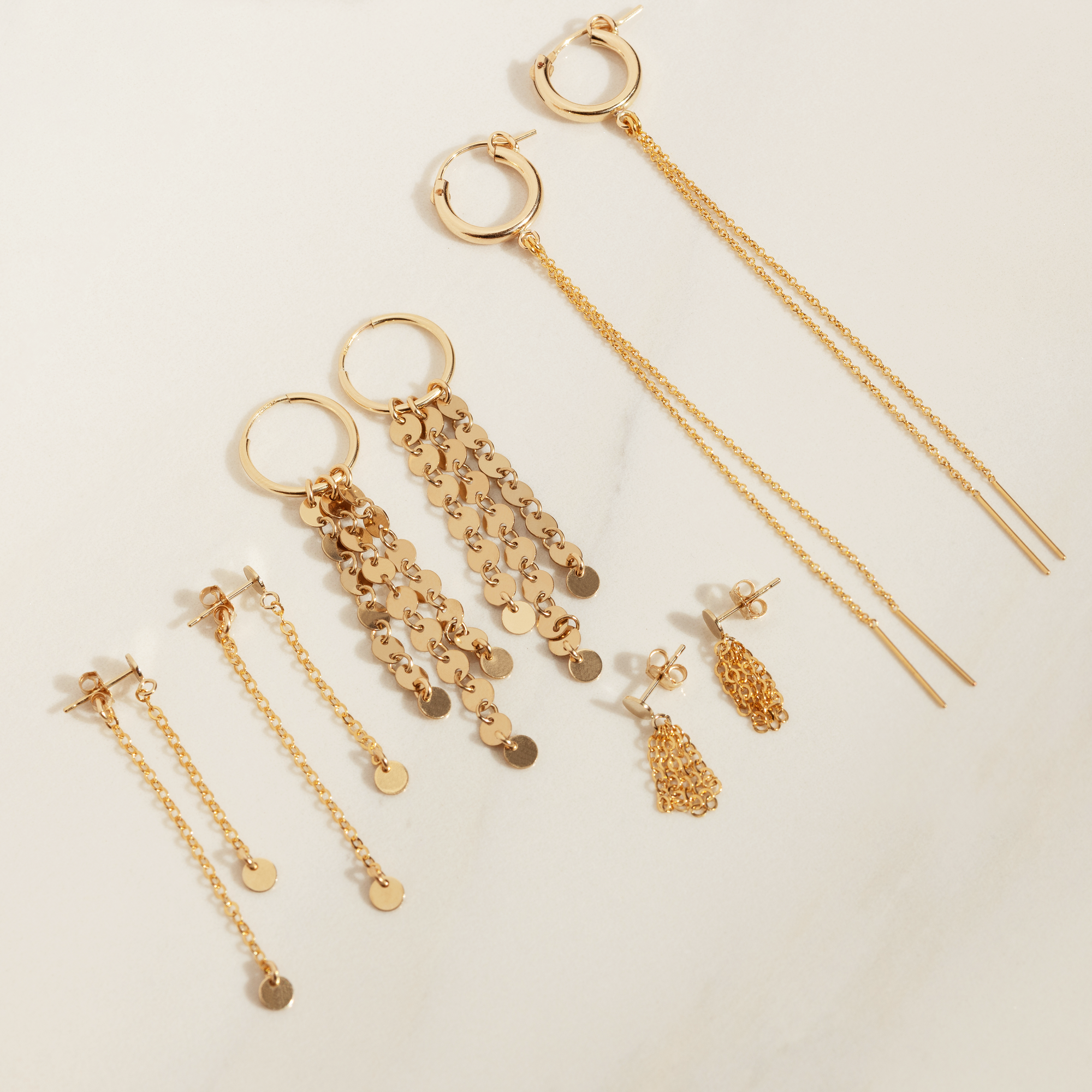 Dubbla skivörhängen med hängande design