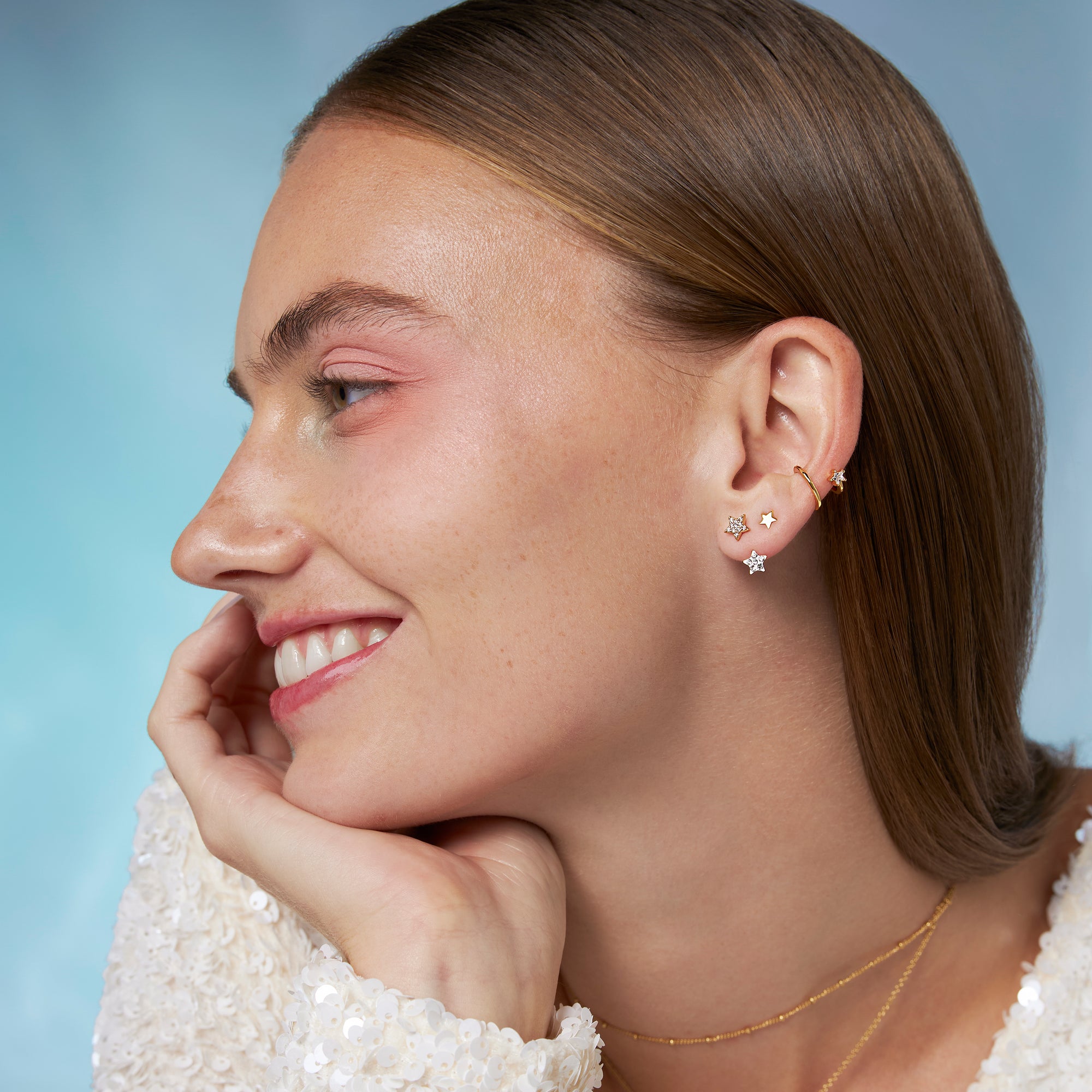 Orecchino a stella scintillante con giacca