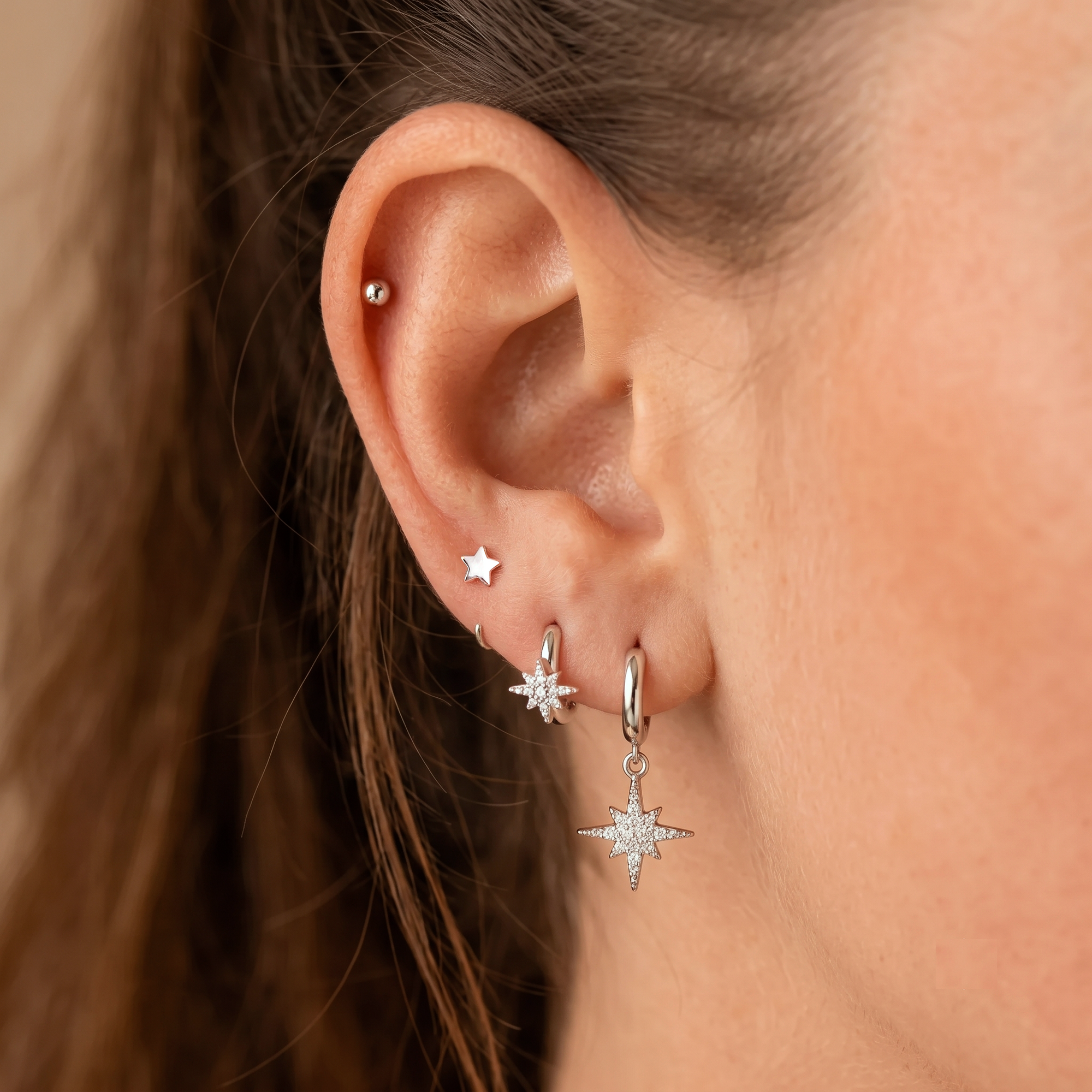 Pendientes de estrella Huggie