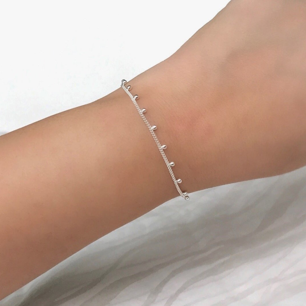 Braccialetto con pallina rimbalzante